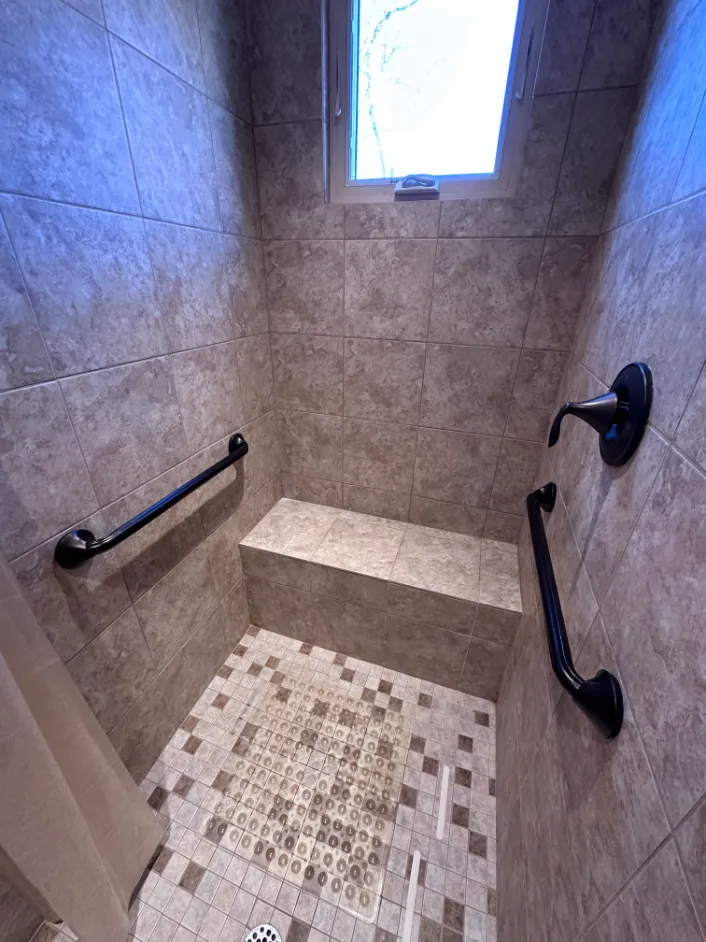 Customized Grab Bars Moen New World Bronze in tile shower